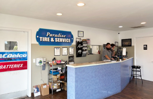 Paradise Tire & Service Technician on phone